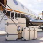 Private jet with luxury luggage awaiting boarding