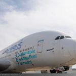 Airbus A380 close up showing 100% sustainable aviation fuel onboard logo