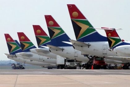 A collection of South African Airlines aircraft parked on the tarmac at Johannesburg