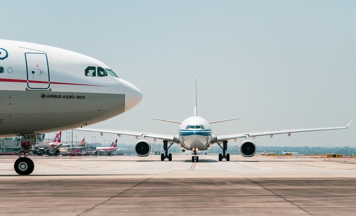 The image of Airbus A330-300 and another airplane preparing for takeoff.