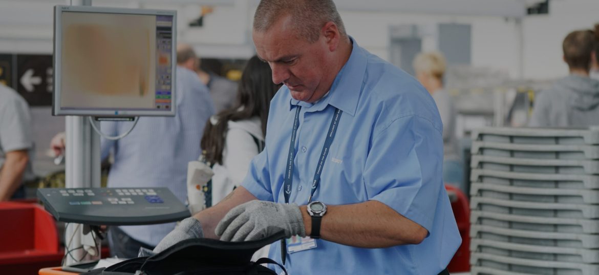 A man inspecting a bag