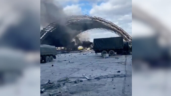 Footage showing extensive fire damage to the hanger and aircraft