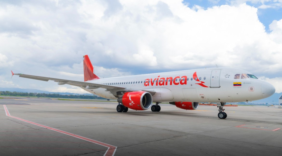 Stationary Avianca aircraft parked on the tarmac with logo visible on the tail.