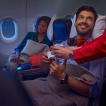 Passengers smiling on Avianca flight