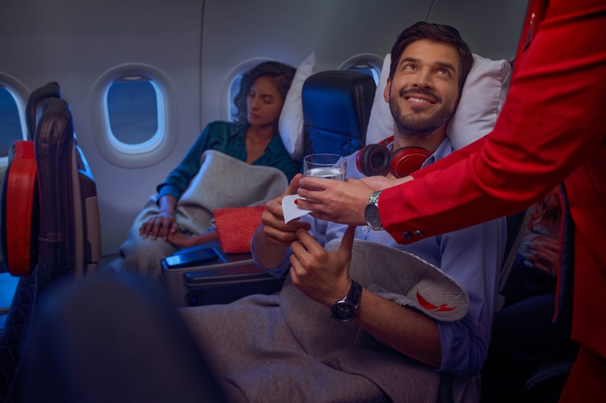 Passengers smiling on Avianca flight