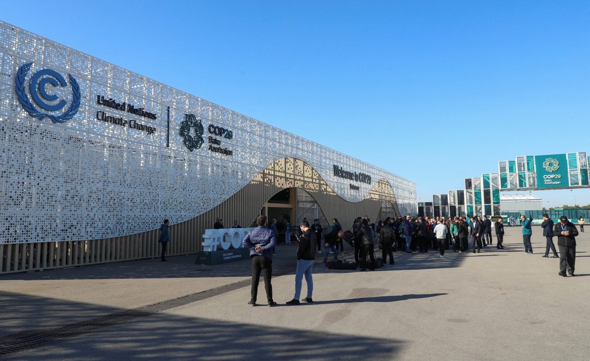 People stand in front of a building