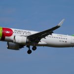 TAP Air Portugal Air Bus A320 flying in the sky