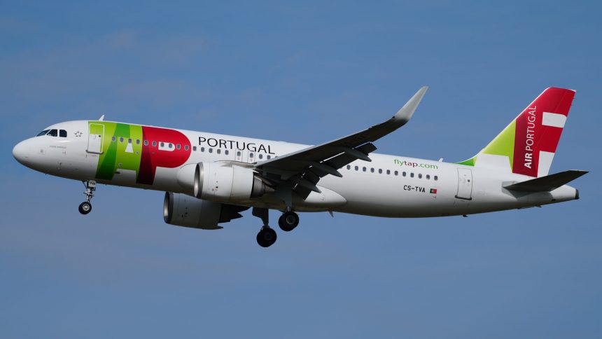 TAP Air Portugal Air Bus A320 flying in the sky