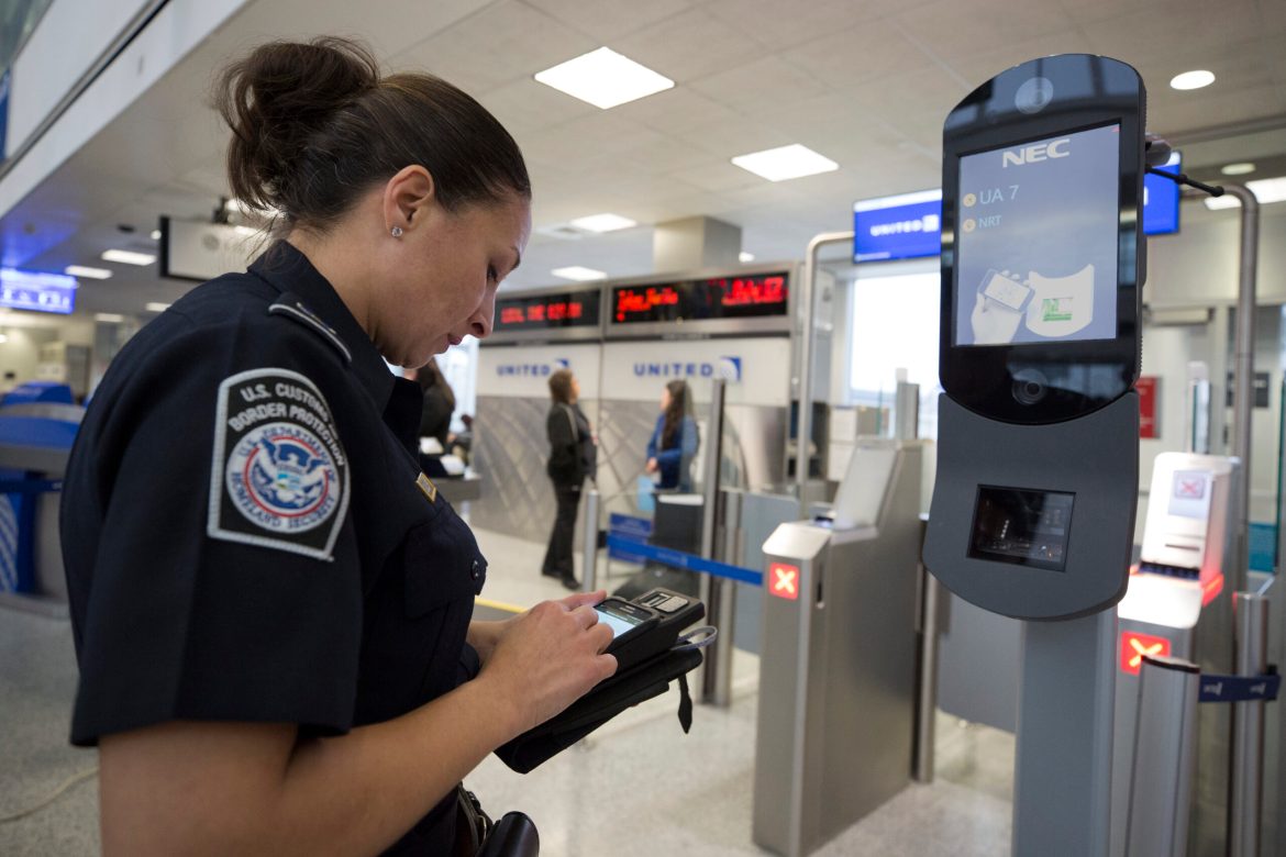 U.S. Customs and Border Protection, Office of Field Operations, officers take biometric photos of passengers prior to boarding a flight at Houston International Airport on February 12, 2018.