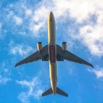 View of Emirates plane flying above