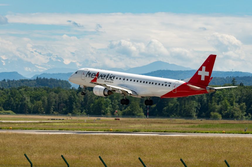 Zurich, Switzerland, June 16, 2024 HB-JVM Helvetic Airways Embraer E190LR aircraft is landing on runway 14