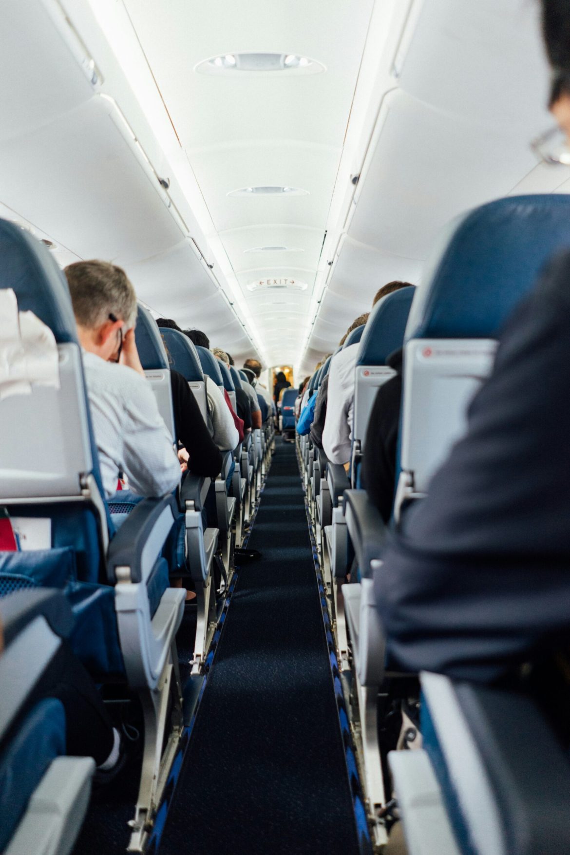 Passengers sitting inside plane