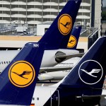 Four Lufthansa planes in a row signalling the aircraft will continue to operate and will not be overcome by strikes