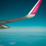 Wing of Wizzair plane taken from the plane when flying