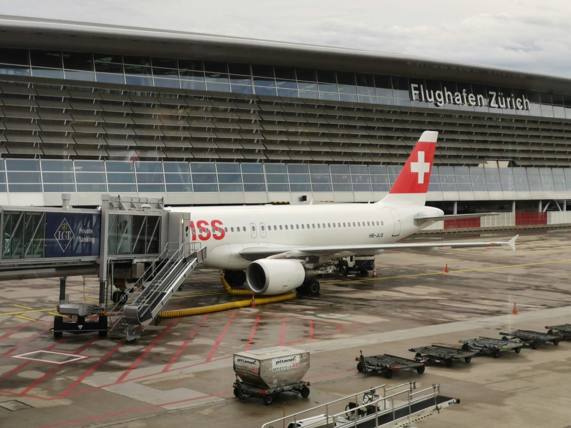 A large jet sitting on top of an airport tarmac